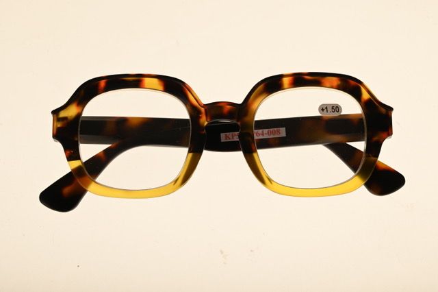 a pair of glasses sitting on top of a table