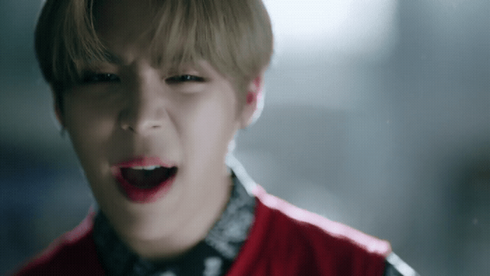 a person with a red jacket and a black and white shirt