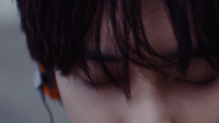a close up of a person with long hair