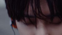 a close up of a person with long hair