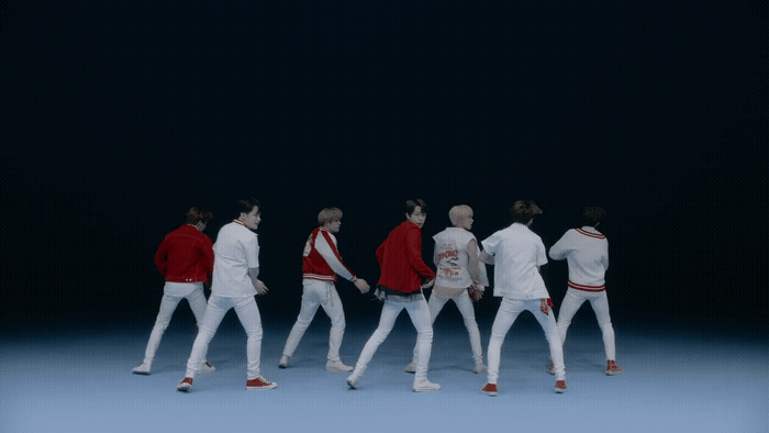 a group of men in white and red outfits