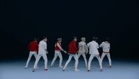 a group of men in white and red outfits
