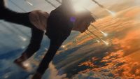 a man flying through the air while riding a skateboard