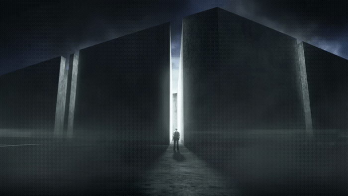 a man standing in front of a tall building