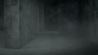 a black and white photo of a dark hallway