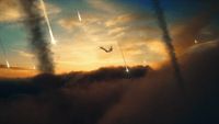 a plane flying through a cloudy sky at sunset