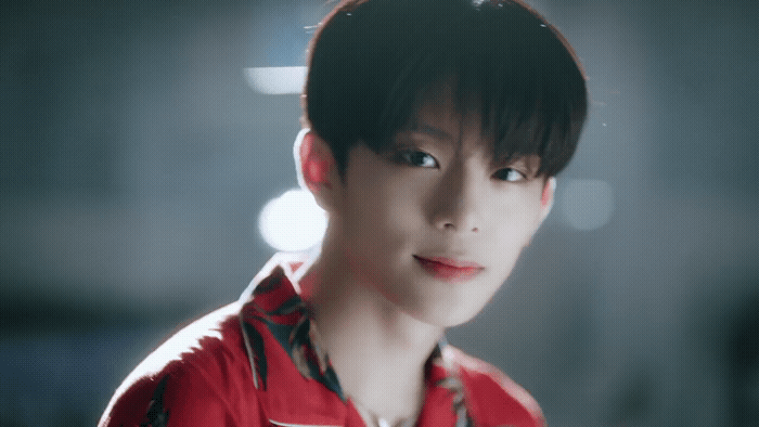 a man with a red shirt and a tie