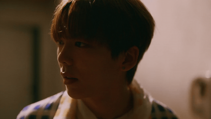 a man with a scarf around his neck