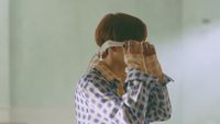 a woman with a blindfold covering her eyes