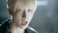 a person with blonde hair making a surprised face