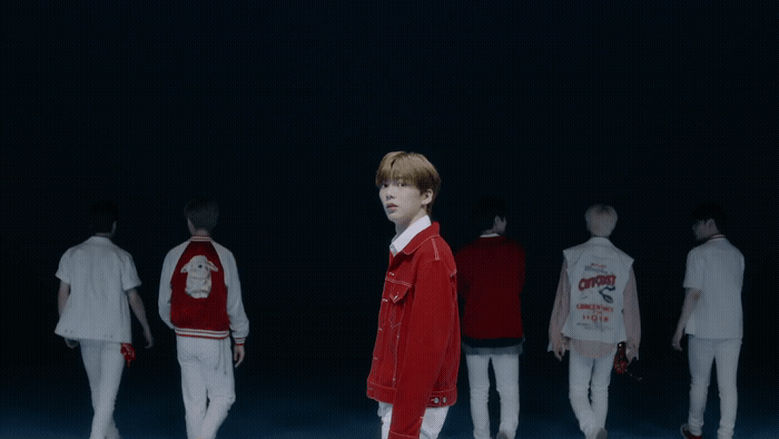 a group of young men standing next to each other