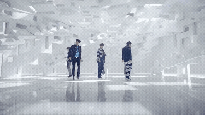 a group of people standing in a room