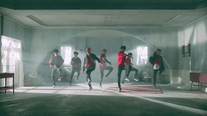 a group of young men running in a room