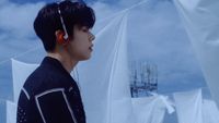 a young man with ear buds on his ears