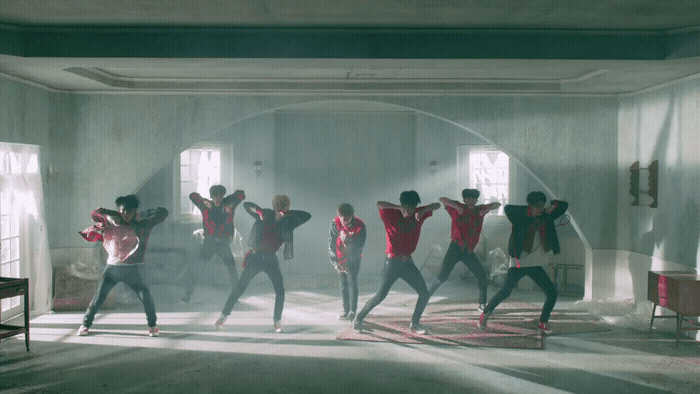 a group of people dancing in a room