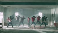 a group of people dancing in a room