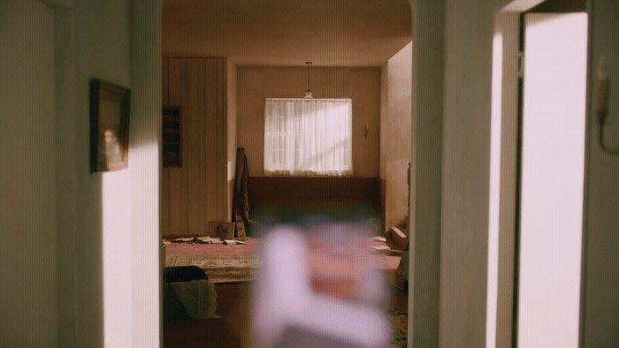 a blurry photo of a hallway in a house