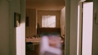 a blurry photo of a hallway in a house