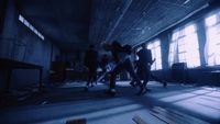 a group of people walking through a dark room