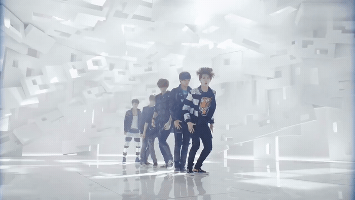 a group of young men standing next to each other