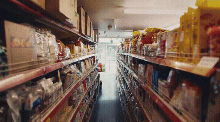 a grocery store aisle filled with lots of food