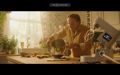 a man is preparing food in a kitchen