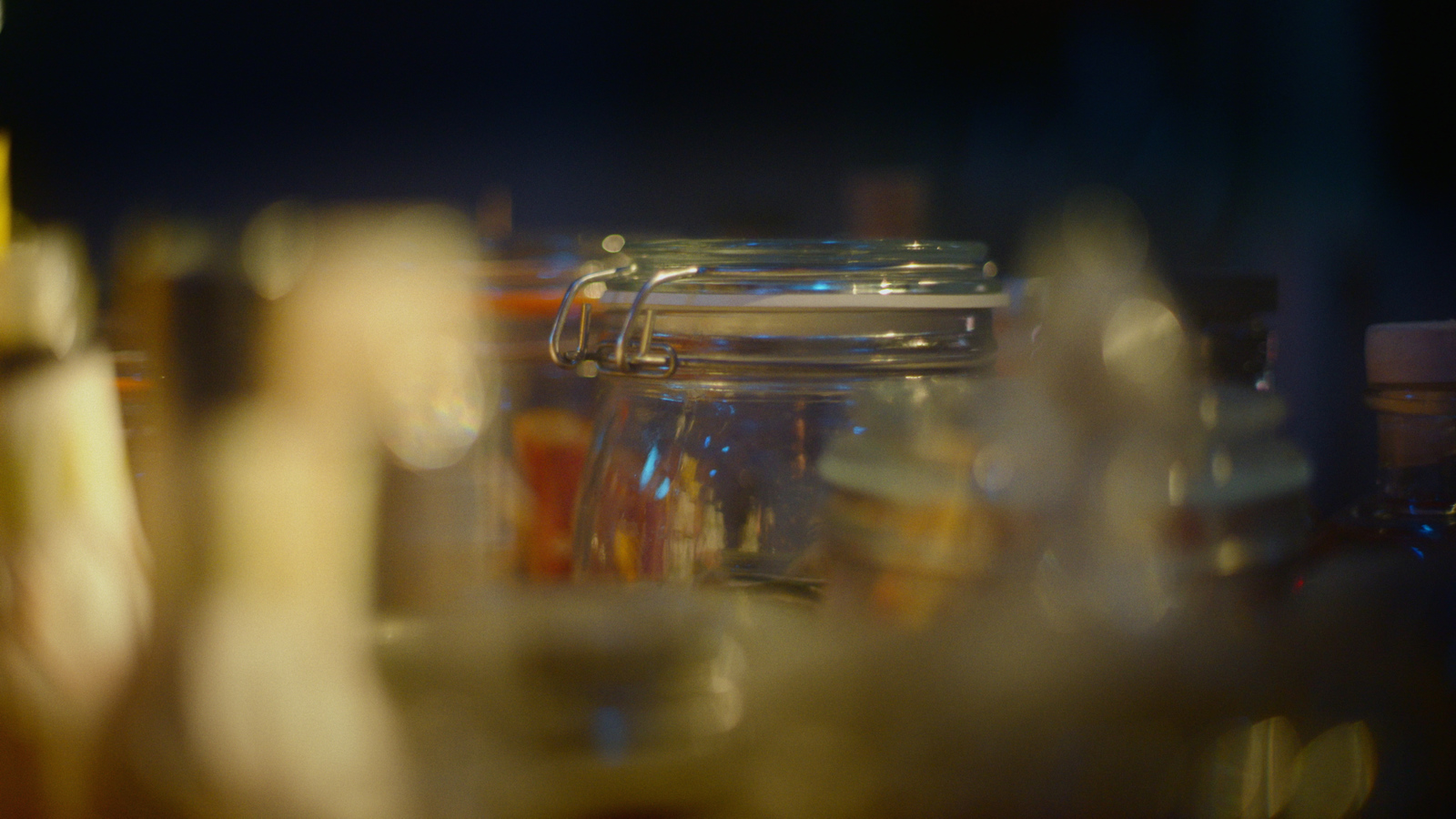 a glass jar filled with lots of liquid