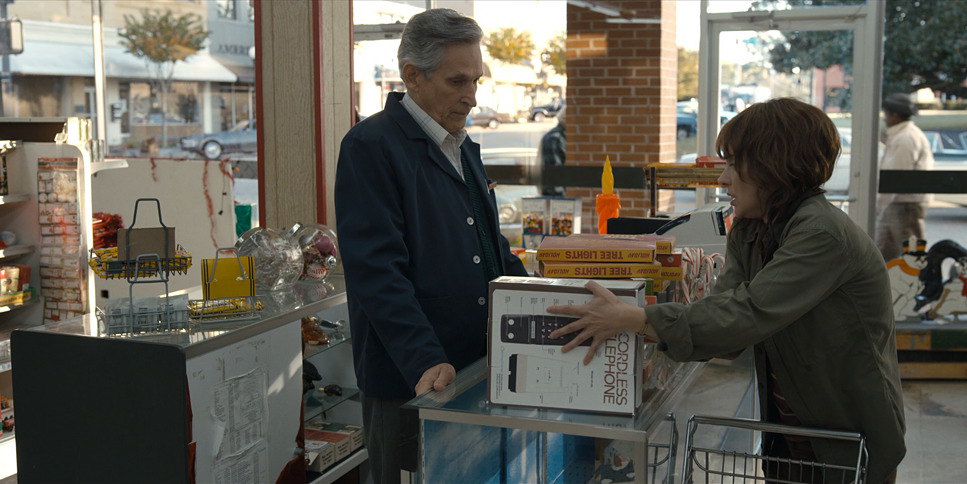 a man and a woman standing in a store