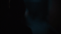 a blurry photo of a person in the dark