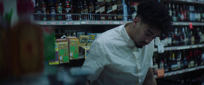 a man standing in front of a store shelf