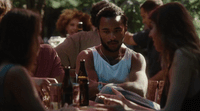 a group of people sitting around a table