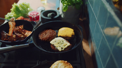 a couple of pans filled with food on top of a stove