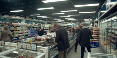 a couple of people that are standing in a store