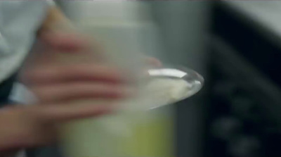 a blurry image of a person holding a blender