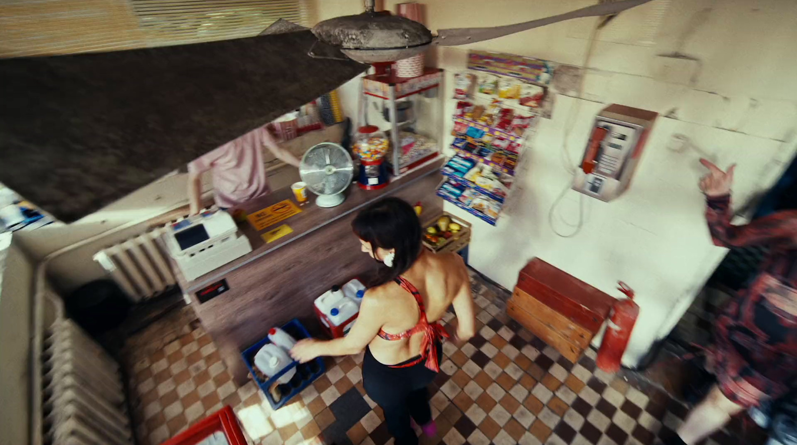 a woman standing in a kitchen next to a stove top oven