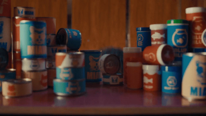 a bunch of cans of food sitting on a table