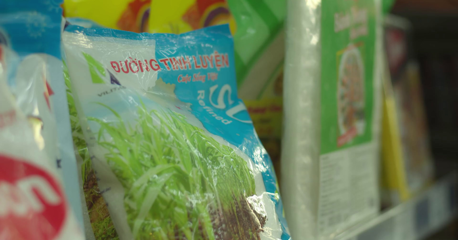 a bunch of bags of food sitting on a shelf