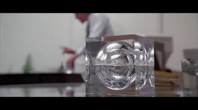 a clear glass object sitting on top of a table