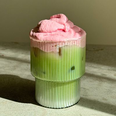 a cupcake with pink frosting on top of it