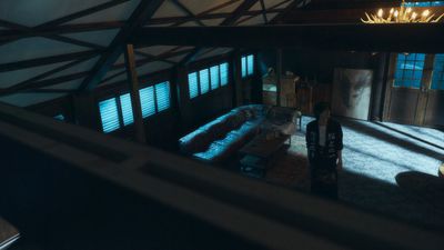 a person standing in a room with a lot of windows