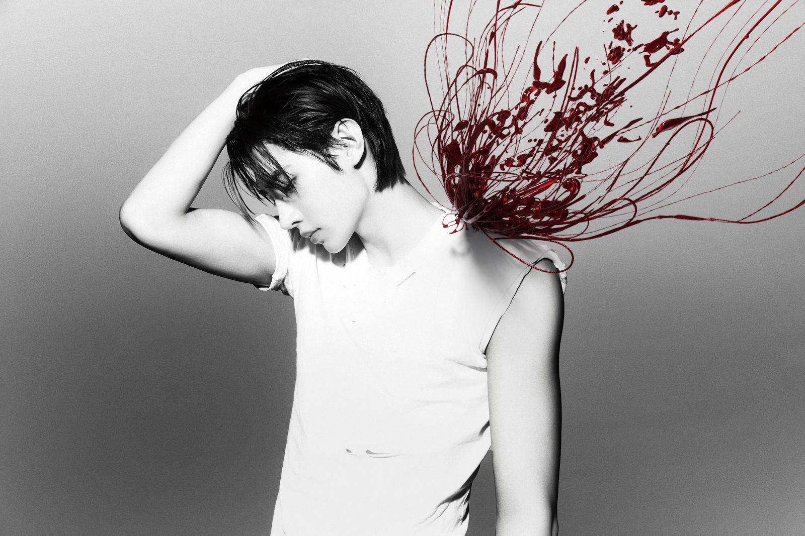a woman with her hair blowing in the wind