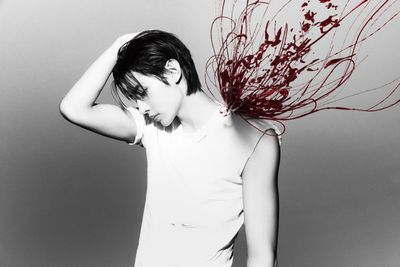 a woman with her hair blowing in the wind