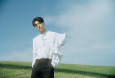 a man in a white shirt and black pants