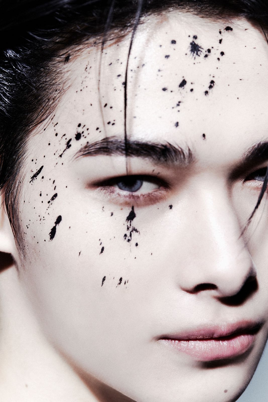 a man with black spots on his face