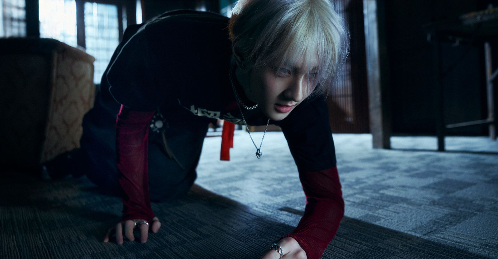 a woman in a black shirt is on the floor