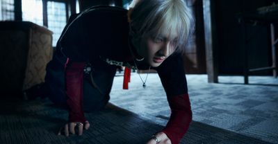 a woman in a black shirt is on the floor