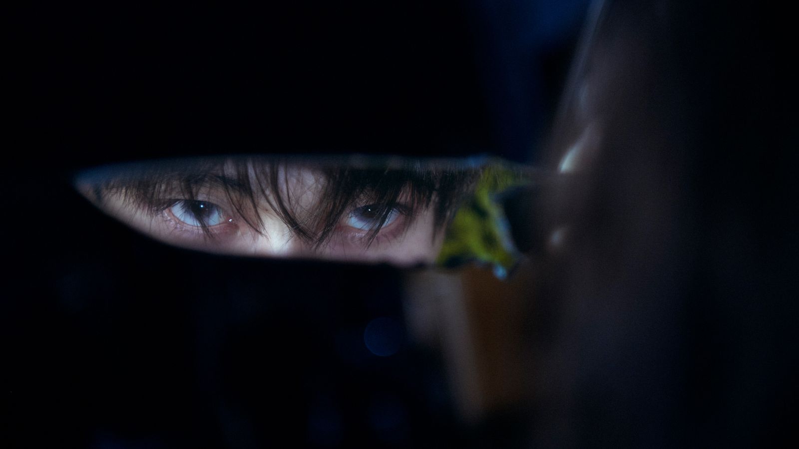 a close up of a person's face in a mirror