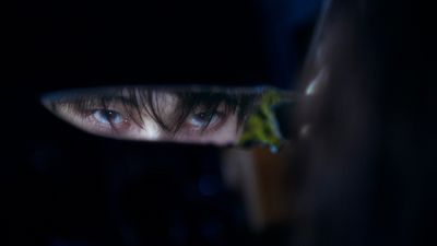 a close up of a person's face in a mirror