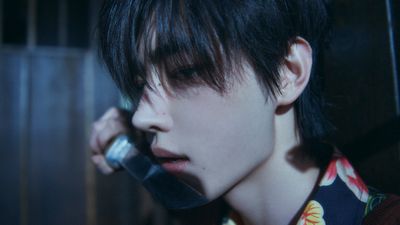 a young man talking on a cell phone