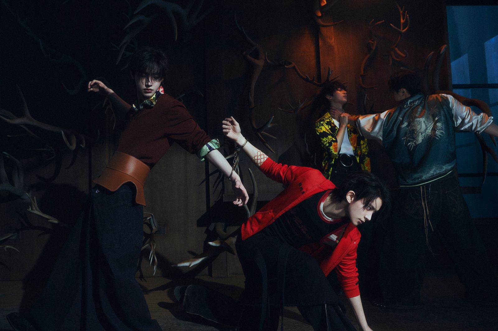 a group of people dancing in a dark room